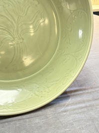 A rare and large Chinese Longquan celadon 'lotus bouquet' dish, Ming, early 15th C.