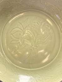 A rare and large Chinese Longquan celadon 'lotus bouquet' dish, Ming, early 15th C.
