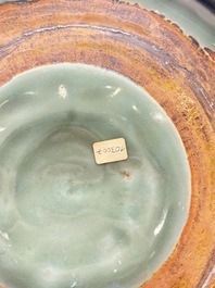 A rare and large Chinese Longquan celadon 'lotus bouquet' dish, Ming, early 15th C.