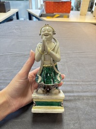 A Chinese sancai-glazed figure of Sudhana, 19th C.