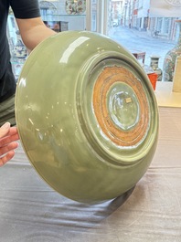 A rare and large Chinese Longquan celadon 'lotus bouquet' dish, Ming, early 15th C.