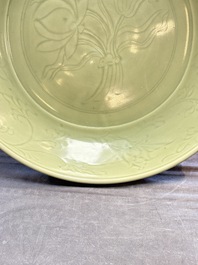 A rare and large Chinese Longquan celadon 'lotus bouquet' dish, Ming, early 15th C.