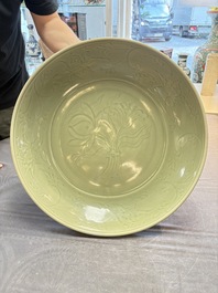 A rare and large Chinese Longquan celadon 'lotus bouquet' dish, Ming, early 15th C.
