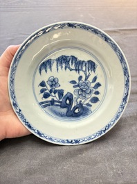 18 Chinese blue and white plates and saucers with floral design, 18th C.