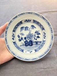 18 Chinese blue and white plates and saucers with floral design, 18th C.