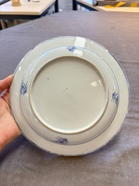 18 Chinese blue and white plates and saucers with floral design, 18th C.