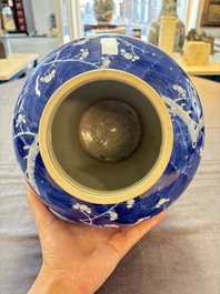 A Chinese Dehua blue and white vase, two containers and a 'prunus on cracked ice' vase, Kangxi mark, 18/19th C.