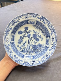 18 Chinese blue and white plates and saucers with floral design, 18th C.