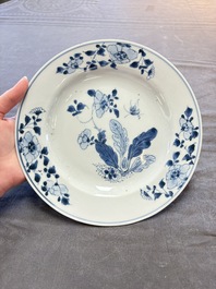 18 Chinese blue and white plates and saucers with floral design, 18th C.