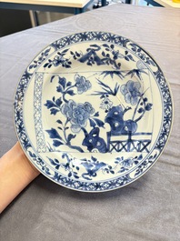 18 Chinese blue and white plates and saucers with floral design, 18th C.