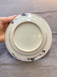 18 Chinese blue and white plates and saucers with floral design, 18th C.