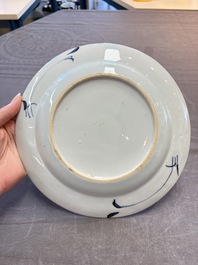 18 Chinese blue and white plates and saucers with floral design, 18th C.