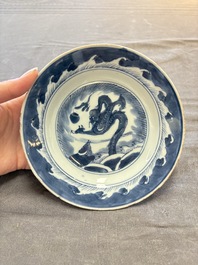 18 Chinese blue and white plates and saucers with floral design, 18th C.