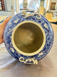 A Chinese Dehua blue and white vase, two containers and a 'prunus on cracked ice' vase, Kangxi mark, 18/19th C.