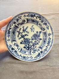 18 Chinese blue and white plates and saucers with floral design, 18th C.