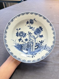 18 Chinese blue and white plates and saucers with floral design, 18th C.