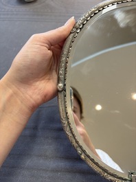 A Chinese silver-plated oval mirror, 19/20th C.