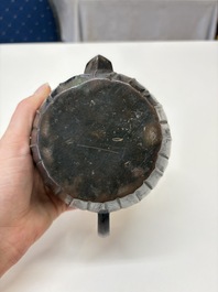 A Chinese bronze teapot and cover with a lion-shaped finial, Yuan