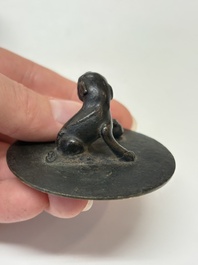 A Chinese bronze teapot and cover with a lion-shaped finial, Yuan