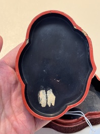 A fine Chinese red cinnabar lacquer ruyi-form 'Ba Man Xian Bao 八蠻獻寶' box and cover, Qianlong