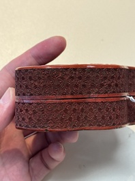 A fine Chinese red cinnabar lacquer ruyi-form 'Ba Man Xian Bao 八蠻獻寶' box and cover, Qianlong