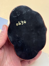 A fine Chinese red cinnabar lacquer ruyi-form 'Ba Man Xian Bao 八蠻獻寶' box and cover, Qianlong