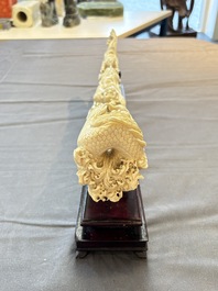 A Chinese ivory carving depicting a Luohan and a dragon, 'Da Ming 大明' mark, 19/20th C.