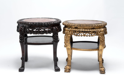 Two Chinese marble-topped hongmu two-tier stands, one with later gilding, 19/20th C.