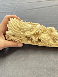 A Chinese ivory carving depicting a Luohan and a dragon, 'Da Ming 大明' mark, 19/20th C.