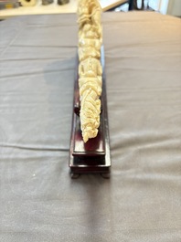 A Chinese ivory carving depicting a Luohan and a dragon, 'Da Ming 大明' mark, 19/20th C.