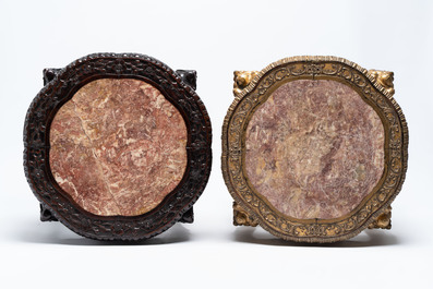 Two Chinese marble-topped hongmu two-tier stands, one with later gilding, 19/20th C.