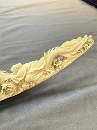 A Chinese ivory carving depicting a Luohan and a dragon, 'Da Ming 大明' mark, 19/20th C.