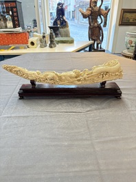 A Chinese ivory carving depicting a Luohan and a dragon, 'Da Ming 大明' mark, 19/20th C.