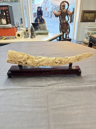 A Chinese ivory carving depicting a Luohan and a dragon, 'Da Ming 大明' mark, 19/20th C.