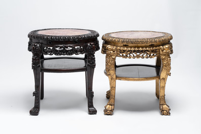 Two Chinese marble-topped hongmu two-tier stands, one with later gilding, 19/20th C.