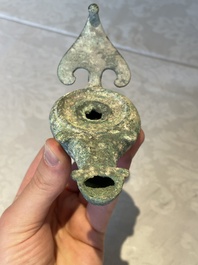 A bronze urn, a bronze canteen with relief design and a pair of bronze oil lamps, Etruscan and Roman civilizations, 9th C. B.C/5th C.