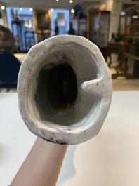 Two Chinese Dehua blanc de Chine wine cups and a figure of Liuhai, 18/19th C.