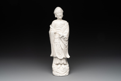 Two Chinese Dehua blanc de Chine wine cups and a figure of Liuhai, 18/19th C.