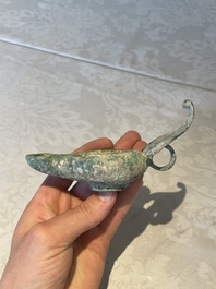 A bronze urn, a bronze canteen with relief design and a pair of bronze oil lamps, Etruscan and Roman civilizations, 9th C. B.C/5th C.