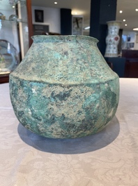 A bronze urn, a bronze canteen with relief design and a pair of bronze oil lamps, Etruscan and Roman civilizations, 9th C. B.C/5th C.