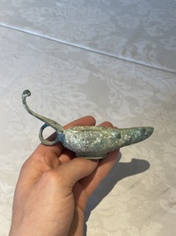 A bronze urn, a bronze canteen with relief design and a pair of bronze oil lamps, Etruscan and Roman civilizations, 9th C. B.C/5th C.