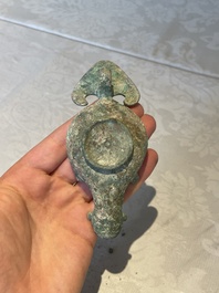 A bronze urn, a bronze canteen with relief design and a pair of bronze oil lamps, Etruscan and Roman civilizations, 9th C. B.C/5th C.