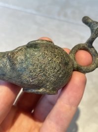 A bronze urn, a bronze canteen with relief design and a pair of bronze oil lamps, Etruscan and Roman civilizations, 9th C. B.C/5th C.