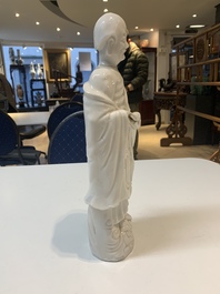 Two Chinese Dehua blanc de Chine wine cups and a figure of Liuhai, 18/19th C.