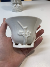 Two Chinese Dehua blanc de Chine wine cups and a figure of Liuhai, 18/19th C.