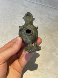 A bronze urn, a bronze canteen with relief design and a pair of bronze oil lamps, Etruscan and Roman civilizations, 9th C. B.C/5th C.