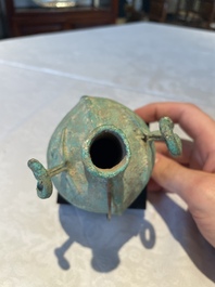 A bronze urn, a bronze canteen with relief design and a pair of bronze oil lamps, Etruscan and Roman civilizations, 9th C. B.C/5th C.