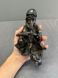 A Japanese gold-splashed bronze incense burner in the shape of an immortal riding a buffalo, ​​Kin San Sō On 金産宗音製造 mark, Meiji, 19th C.