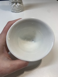 Two Chinese Dehua blanc de Chine wine cups and a figure of Liuhai, 18/19th C.