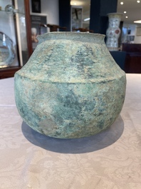 A bronze urn, a bronze canteen with relief design and a pair of bronze oil lamps, Etruscan and Roman civilizations, 9th C. B.C/5th C.